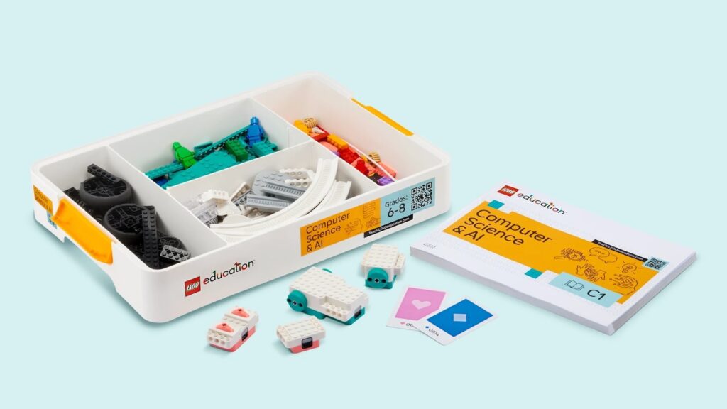 Teacher and students collaborating with the LEGO Education kit